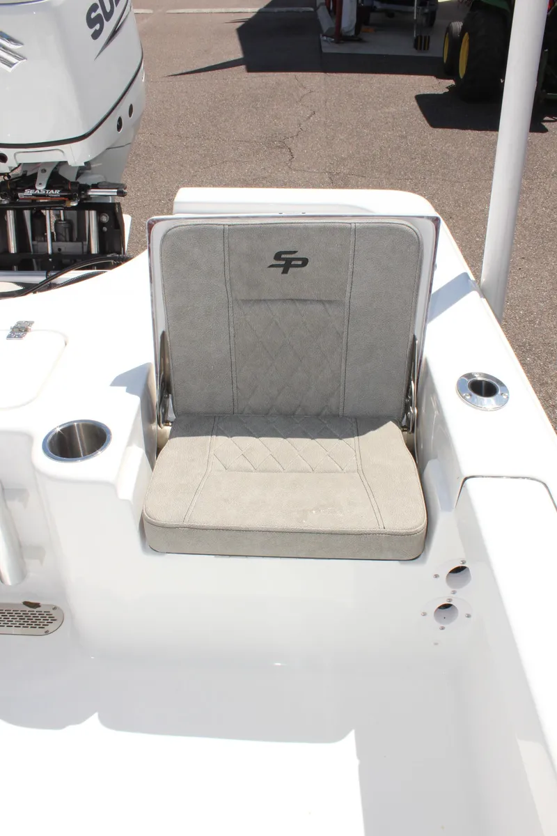 Slide: The Image of 2025 Sea Pro 230 Bay boat seat with cup holders and motor detail. - 11