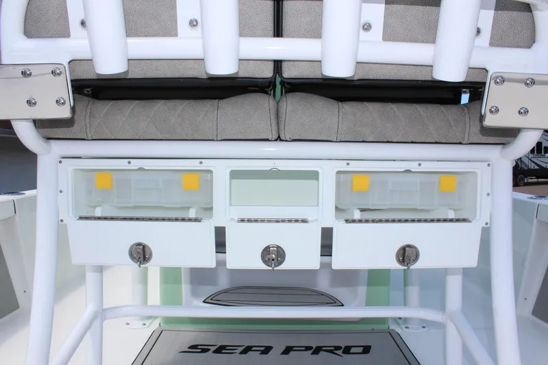 Slide: The Image of 2025 Sea Pro 230 Bay boat storage compartments and seating area. - 22