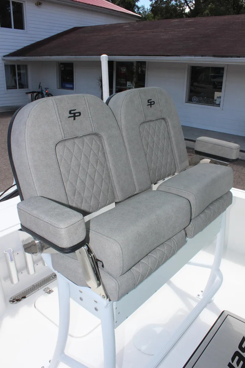Slide: The Image of 2025 Sea Pro 230 Bay boat seats with diamond stitching and armrests. - 25