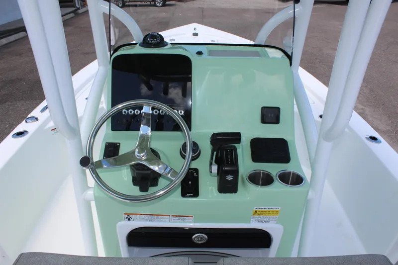Slide: The Image of 2025 Sea Pro 230 Bay boat console with steering wheel and controls. - 27