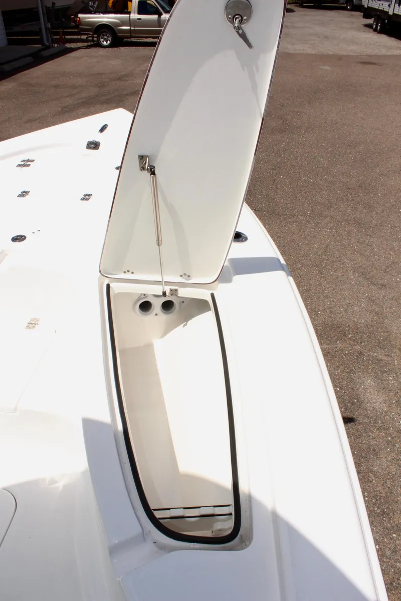 Slide: The Image of 2025 Sea Pro 230 Bay boat storage compartment with open hatch. - 34