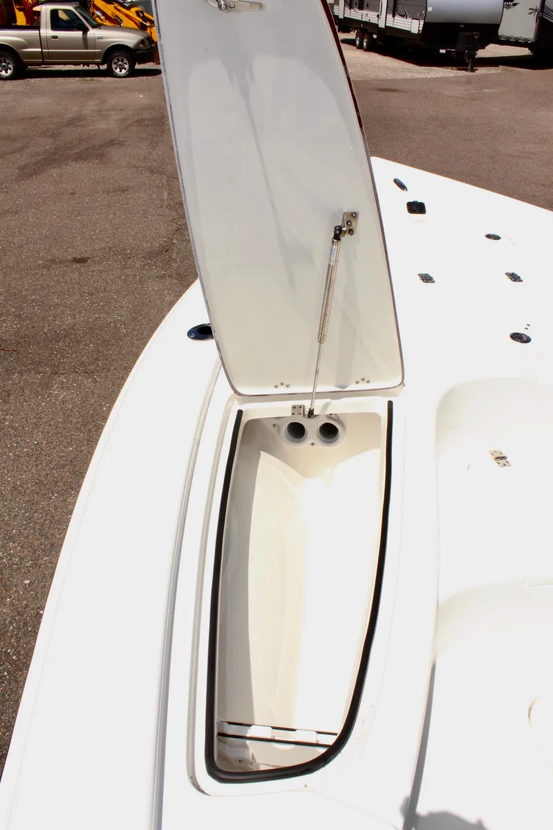 Slide: The Image of 2025 Sea Pro 230 Bay boat storage compartment open on deck. - 35