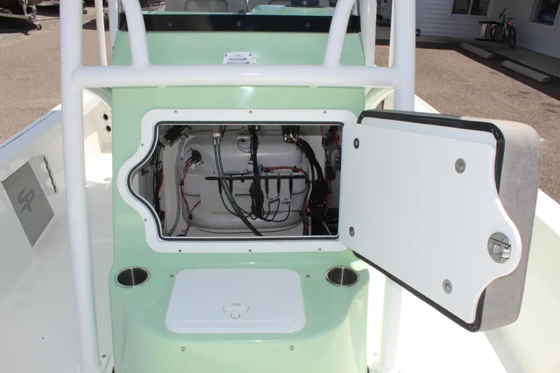 Slide: The Image of 2025 Sea Pro 230 Bay boat with open storage compartment, showcasing internal wiring. - 40