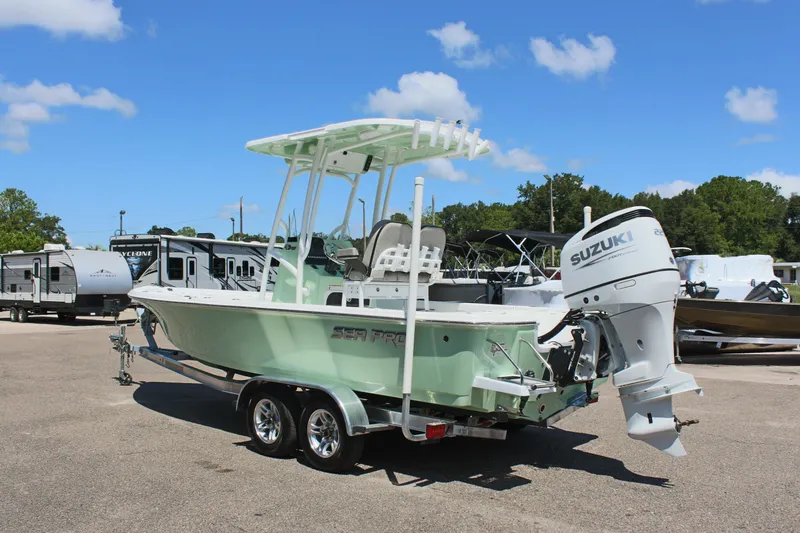 Slide: The Image of 2025 Sea Pro 230 Bay boat with Suzuki outboard motor on trailer. - 7