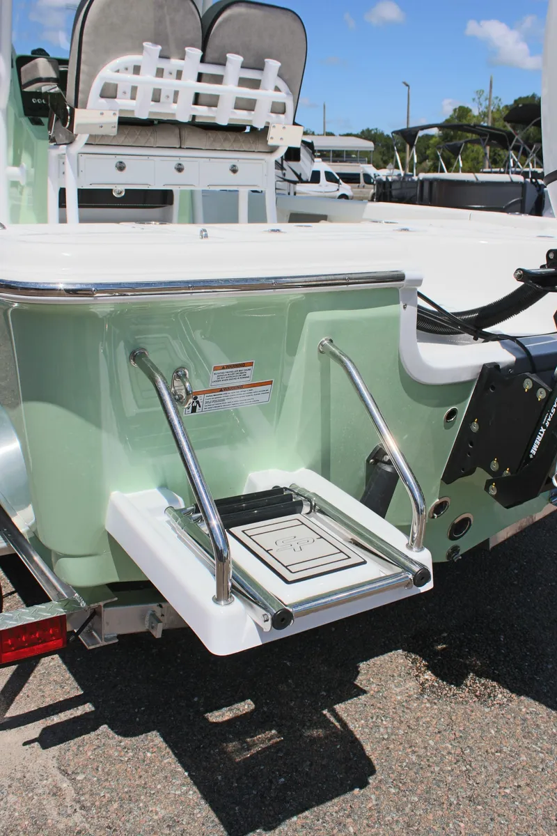 Slide: The Image of 2025 Sea Pro 230 Bay boat with swim ladder and sleek design. - 9