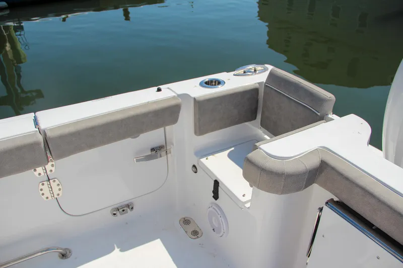 Slide: The Image of 2025 Sea Hunt Gamefish 28 boat interior with cushioned seating and storage. - 12
