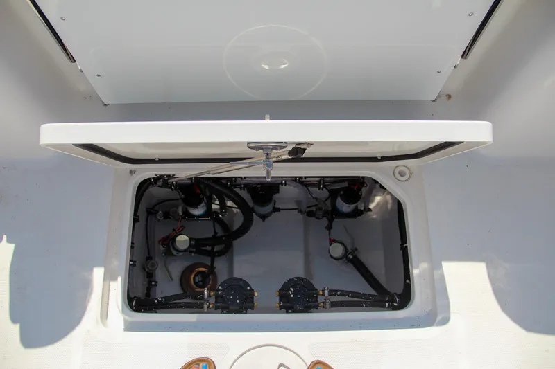 Slide: The Image of Open hatch of 2025 Sea Hunt Gamefish 28 boat, showing internal components. - 16