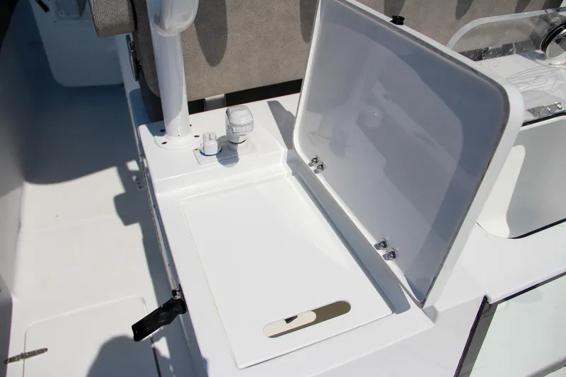 Slide: The Image of 2025 Sea Hunt Gamefish 28 boat storage compartment with open lid. - 18