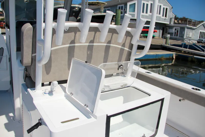 Slide: The Image of 2025 Sea Hunt Gamefish 28 boat with rod holders and storage compartments. - 20