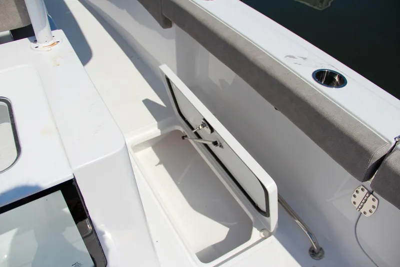 Slide: The Image of Open storage compartment on 2025 Sea Hunt Gamefish 28 boat deck. - 23