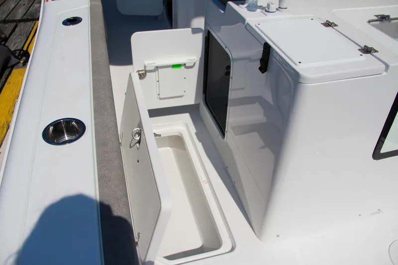 Slide: The Image of 2025 Sea Hunt Gamefish 28 boat storage compartments and deck view. - 25