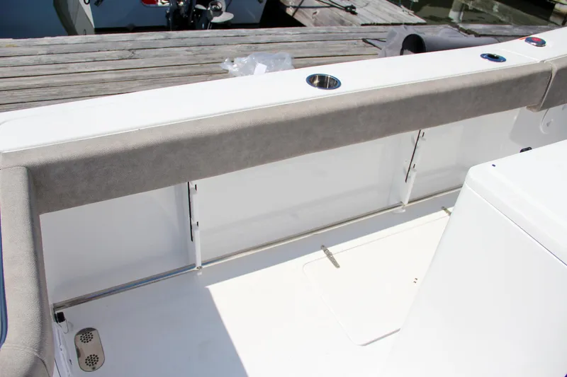 Slide: The Image of 2025 Sea Hunt Gamefish 28 boat interior with cushioned seating and storage compartments. - 27