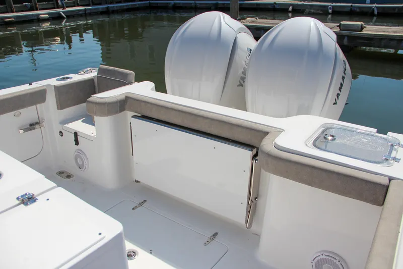 Slide: The Image of 2025 Sea Hunt Gamefish 28 boat with twin Yamaha engines at dock. - 3