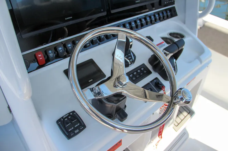 Slide: The Image of Steering console of 2025 Sea Hunt Gamefish 28 boat with modern controls. - 35
