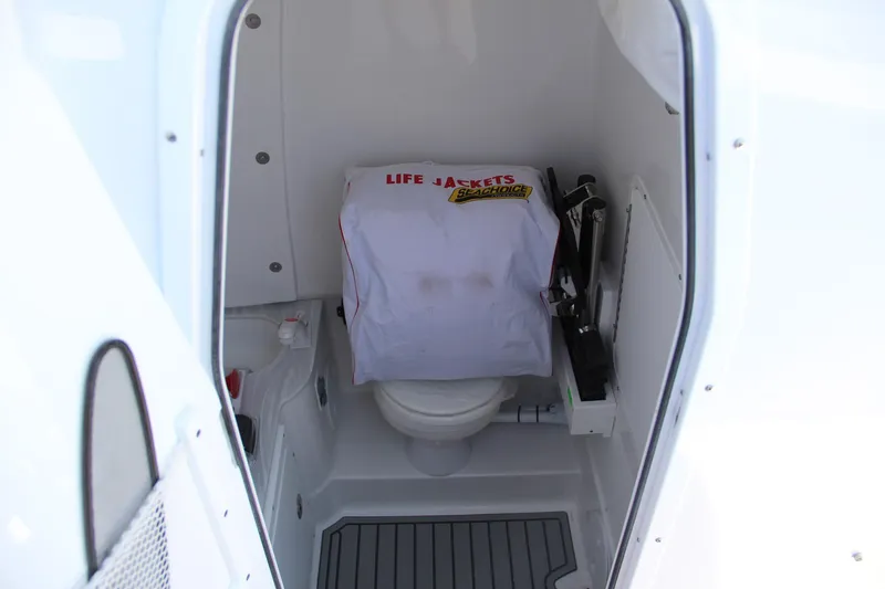 Slide: The Image of 2025 Sea Hunt Gamefish 28 boat interior with toilet and life jackets. - 38
