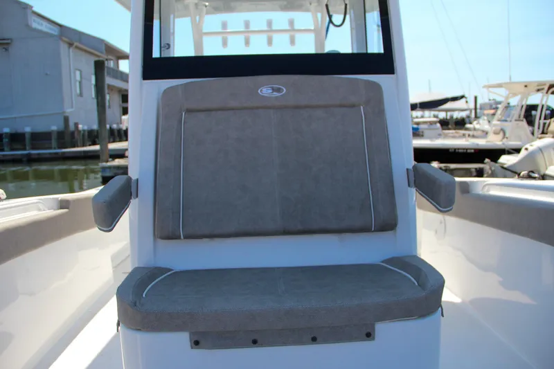 Slide: The Image of 2025 Sea Hunt Gamefish 28 boat interior with cushioned seating. - 42