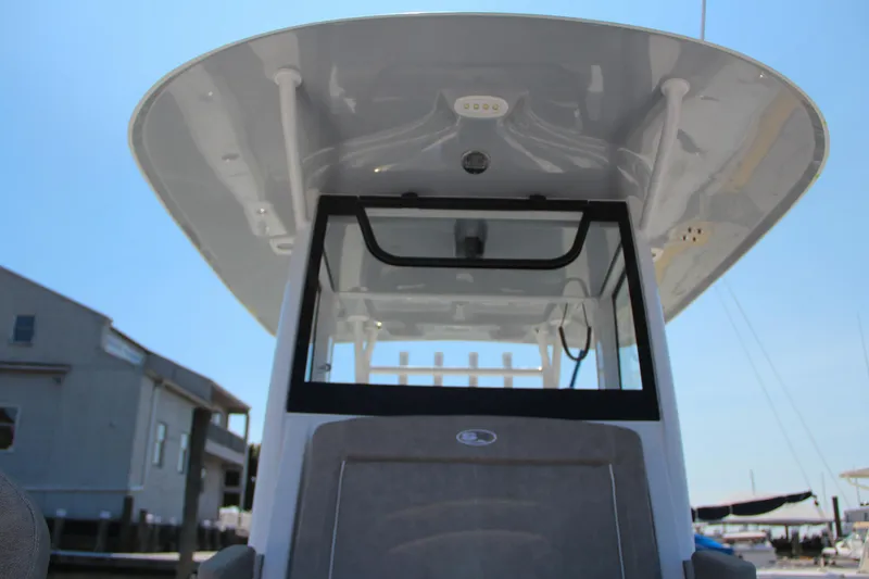 Slide: The Image of 2025 Sea Hunt Gamefish 28 boat, view of helm and T-top structure. - 43