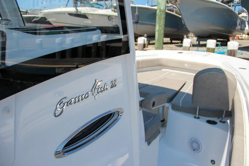Slide: The Image of 2025 Sea Hunt Gamefish 28 boat interior with sleek design and seating. - 44