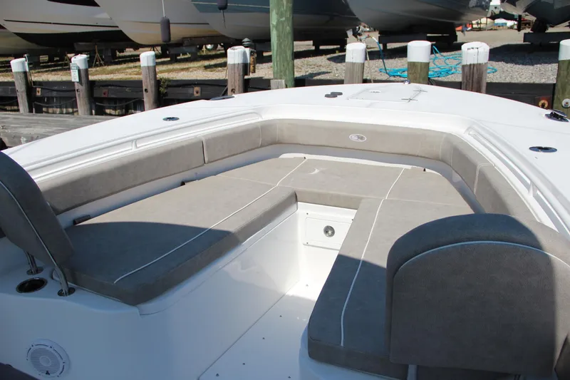 Slide: The Image of 2025 Sea Hunt Gamefish 28 boat interior with cushioned seating and storage. - 48