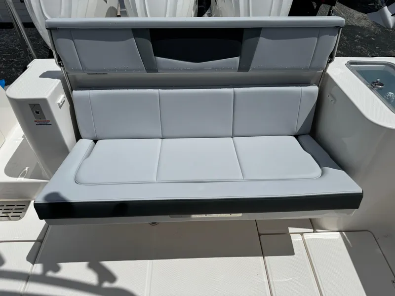 Slide: The Image of 2025 Robalo R360 Center Console boat seat, featuring sleek gray upholstery and modern design. - 12