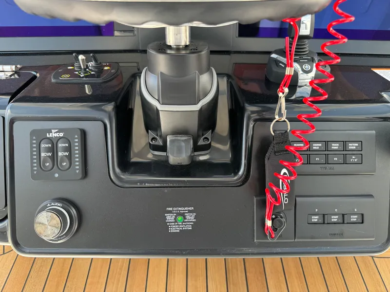 Slide: The Image of 2025 Robalo R360 Center Console boat controls with advanced navigation and communication systems. - 21