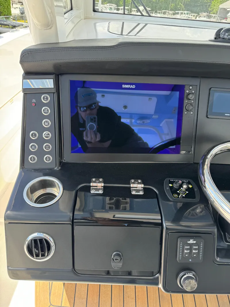 Slide: The Image of 2025 Robalo R360 Center Console dashboard with touchscreen and controls. - 25
