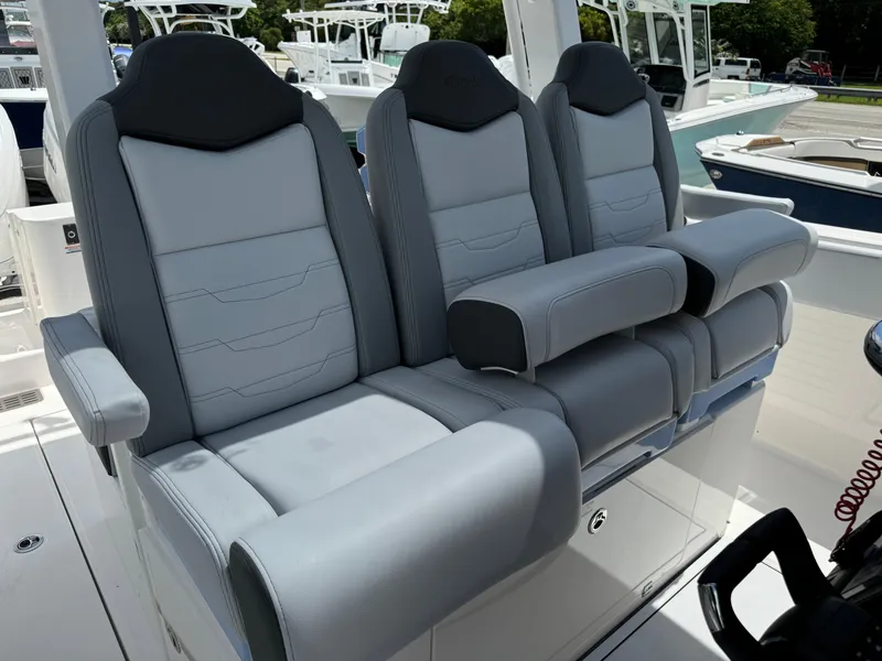 Slide: The Image of 2025 Robalo R360 Center Console boat seats, featuring luxurious gray upholstery and ergonomic design. - 27