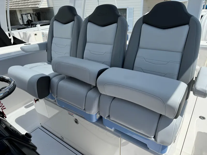 Slide: The Image of 2025 Robalo R360 Center Console boat seats, featuring luxurious gray upholstery and ergonomic design. - 28