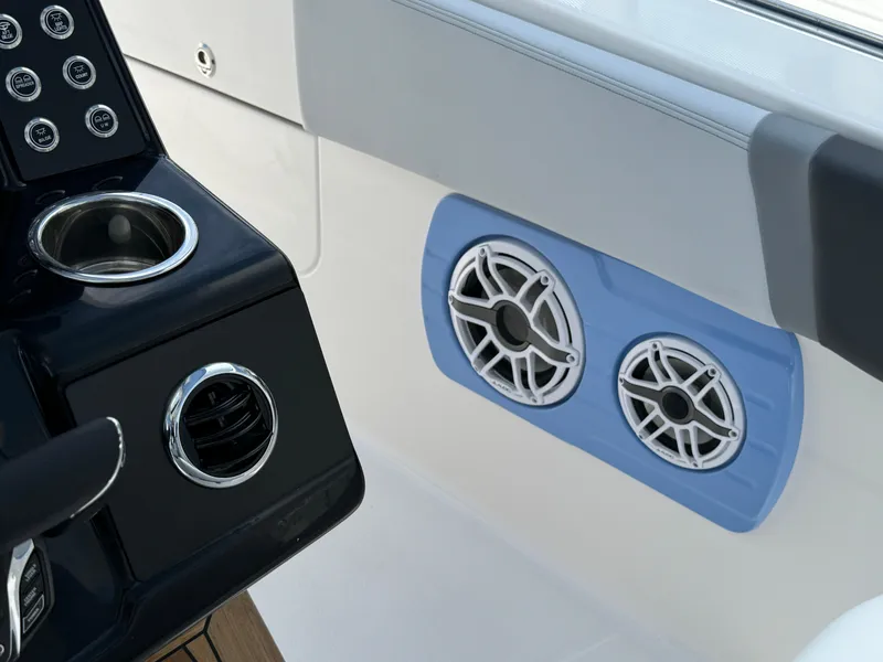 Slide: The Image of 2025 Robalo R360 Center Console interior with dual speakers and control panel. - 30