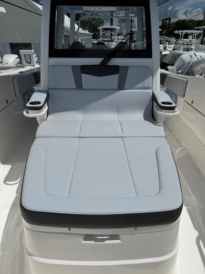 Slide: The Image of 2025 Robalo R360 Center Console boat with sleek seating and modern design. - 35