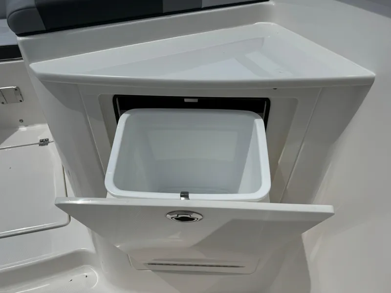Slide: The Image of 2025 Robalo R360 Center Console with open storage compartment. - 39