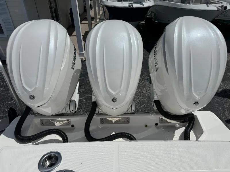 Slide: The Image of Triple outboard engines on a 2025 Robalo R360 Center Console boat. - 4