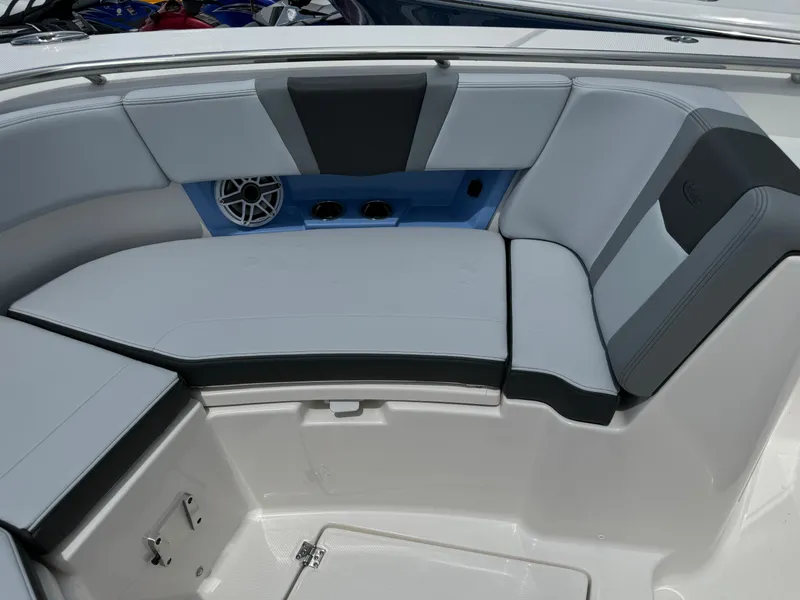 Slide: The Image of 2025 Robalo R360 Center Console boat interior with cushioned seating and speaker system. - 41