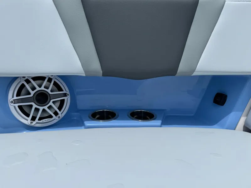 Slide: The Image of 2025 Robalo R360 Center Console interior with speaker and cup holders. - 42