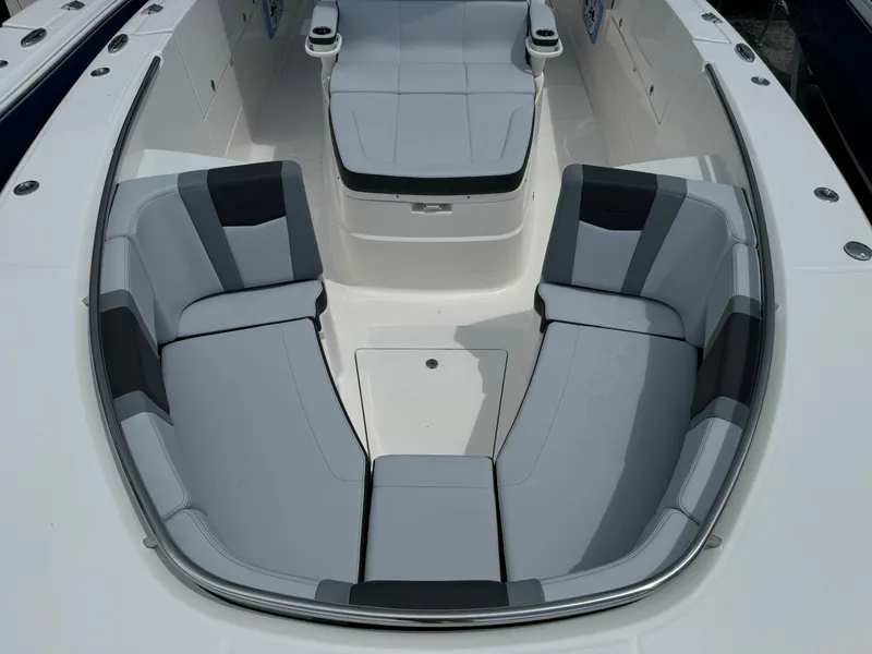 Slide: The Image of 2025 Robalo R360 Center Console boat with spacious seating area and modern design. - 45