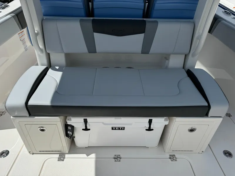 Slide: The Image of 2025 Robalo R360 Center Console seating with integrated Yeti cooler and storage compartments. - 7