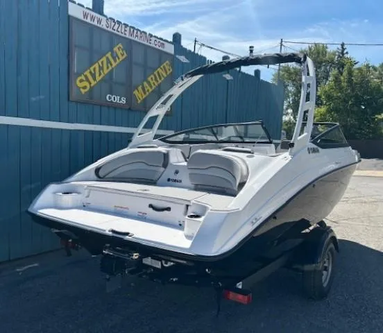 Slide: The Image of 2025 Yamaha AR190 boat on trailer at Sizzle Marine dealership. - 2