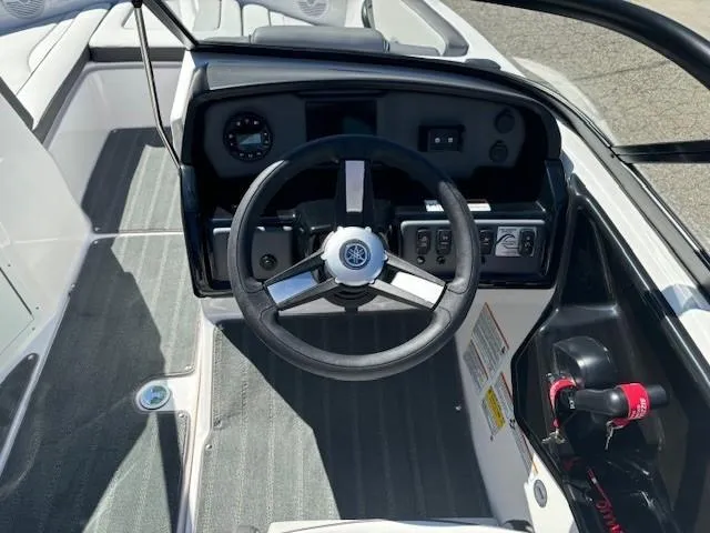 Slide: The Image of 2025 Yamaha Boats AR190 steering console with modern controls and sleek design. - 8