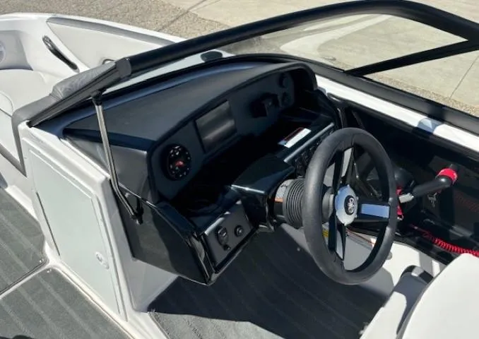 Slide: The Image of 2025 Yamaha Boats AR190 dashboard and steering wheel, featuring modern controls and sleek design. - 9
