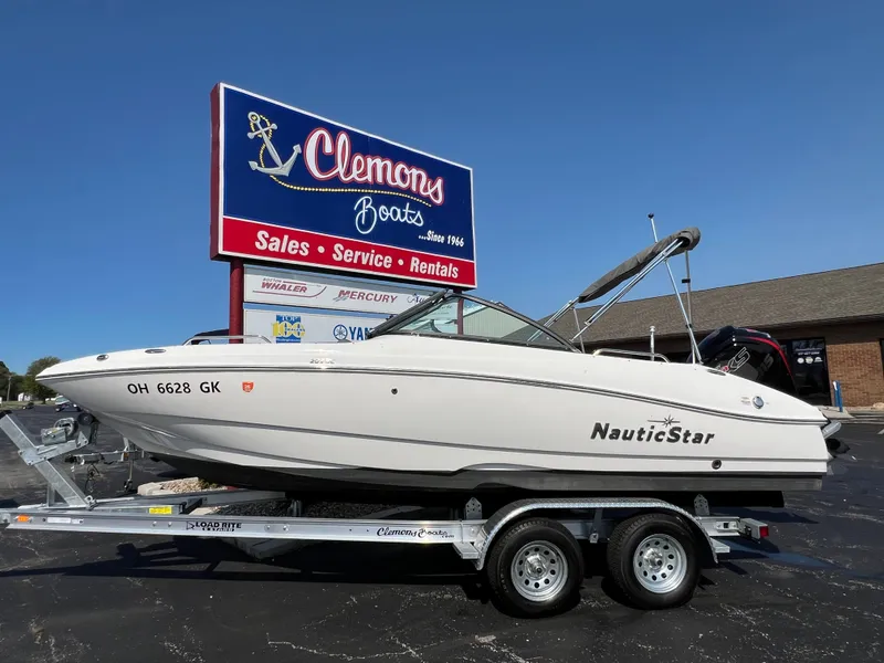 The Image of 2023 NauticStar 203 DC boat on trailer at Clemons Boats dealership. - 0