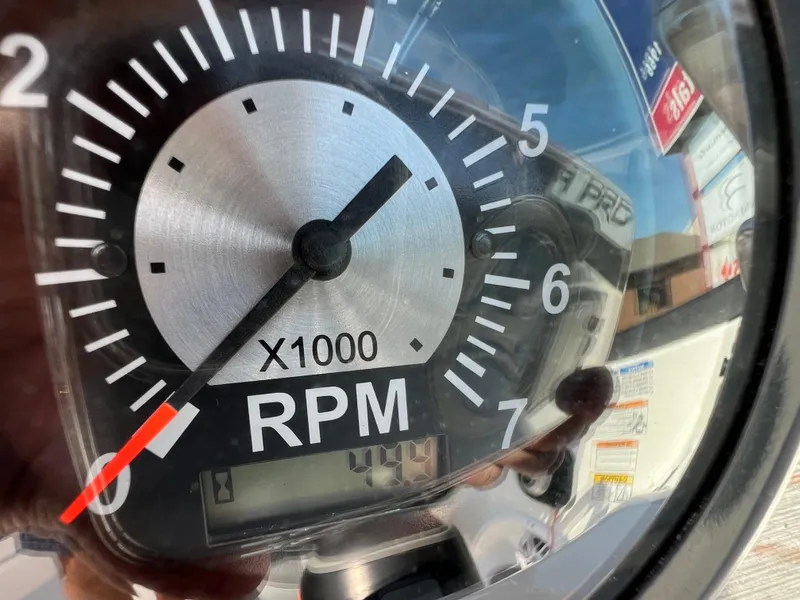 Slide: The Image of Close-up of NauticStar 203 DC 2023 boat tachometer showing RPM gauge. - 14