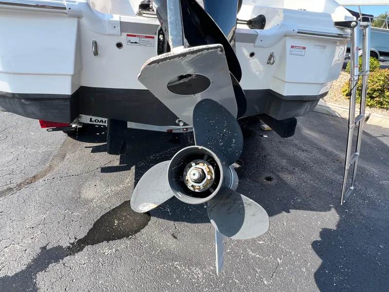 Slide: The Image of 2023 NauticStar 203 DC boat propeller, close-up view on pavement. - 7