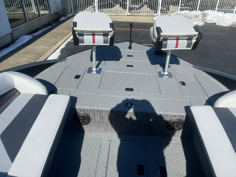Slide: The Image of 2025 Lowe Deck SD224 boat interior with seating and storage compartments. - 11