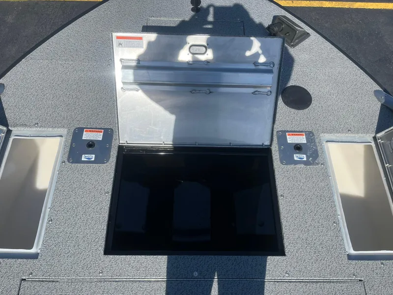 Slide: The Image of 2025 Lowe Deck SD224 boat storage compartment open on deck. - 14