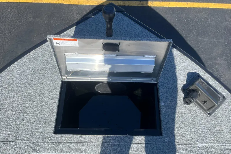 Slide: The Image of Open storage compartment on 2025 Lowe Deck SD224 boat. - 16