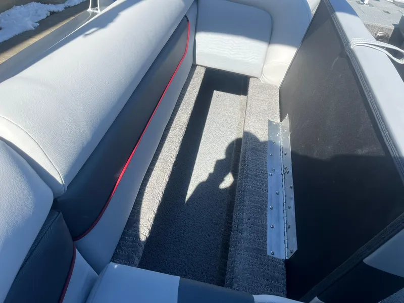 Slide: The Image of 2025 Lowe Deck SD224 boat interior with gray and white seating. - 25