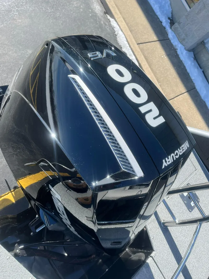 Slide: The Image of Mercury outboard motor on 2025 Lowe Deck SD224 boat, black finish, outdoor setting. - 28