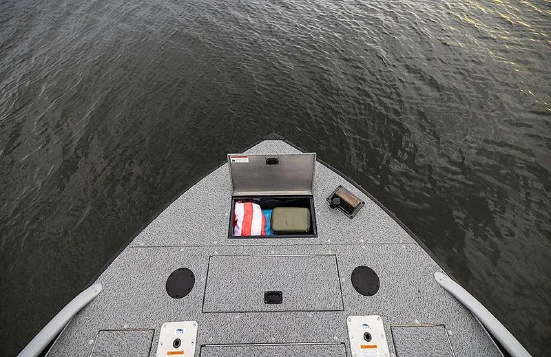 Slide: The Image of Lowe Deck SD224 boat bow with open storage compartment, 2025 model. - 34