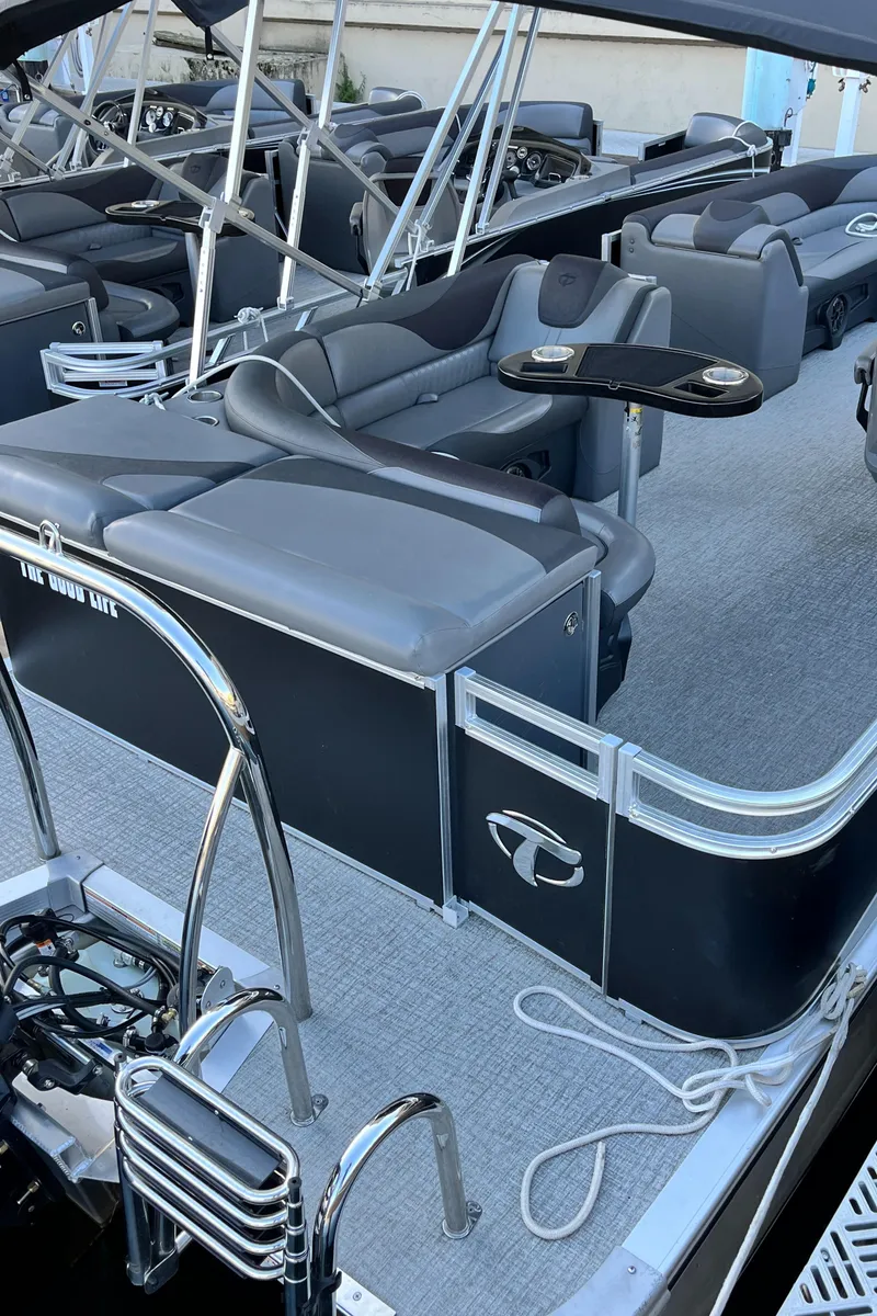 Slide: The Image of 2023 Tahoe Pontoon LTZ Cruise with sleek seating and modern design. - 8