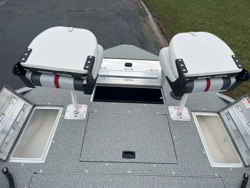 Slide: The Image of 2025 Lowe Deck SD224 boat with dual swivel seats and storage compartments. - 13